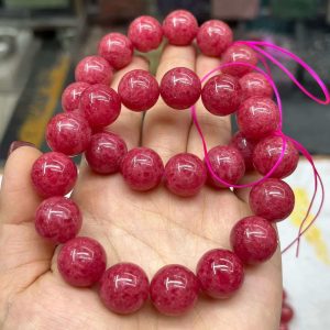 Rose pyroxene glass bracelet is mistaken